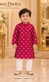 Lakshman Fuchsia size 2: age-appropriate child model wearing the embellished kurta and white polo pajama set.