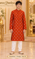 Lakshman Orange size 14: age-appropriate child model wearing the embellished kurta and white polo pajama set.
