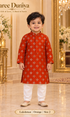 Lakshman Orange size 2: age-appropriate child model wearing the embellished kurta and white polo pajama set.