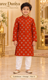 Lakshman Orange size 6: age-appropriate child model wearing the embellished kurta and white polo pajama set.
