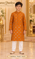Lakshman Peach size 8: age-appropriate child model wearing the embellished kurta and white polo pajama set.
