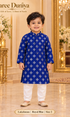 Lakshman Royal Blue size 2: age-appropriate child model wearing the embellished kurta and white polo pajama set.