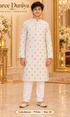 Lakshman White size 14: age-appropriate child model wearing the embellished kurta and white polo pajama set.