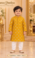 Lakshman Yellow size 2: age-appropriate child model wearing the embellished kurta and white polo pajama set.