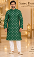 Ram Green adult model wearing an embellished kurta and white polo pajama in the Saree Duniya showroom.