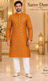 Ram Peach adult model wearing the embellished kurta and white polo pajama set in the Saree Duniya showroom.