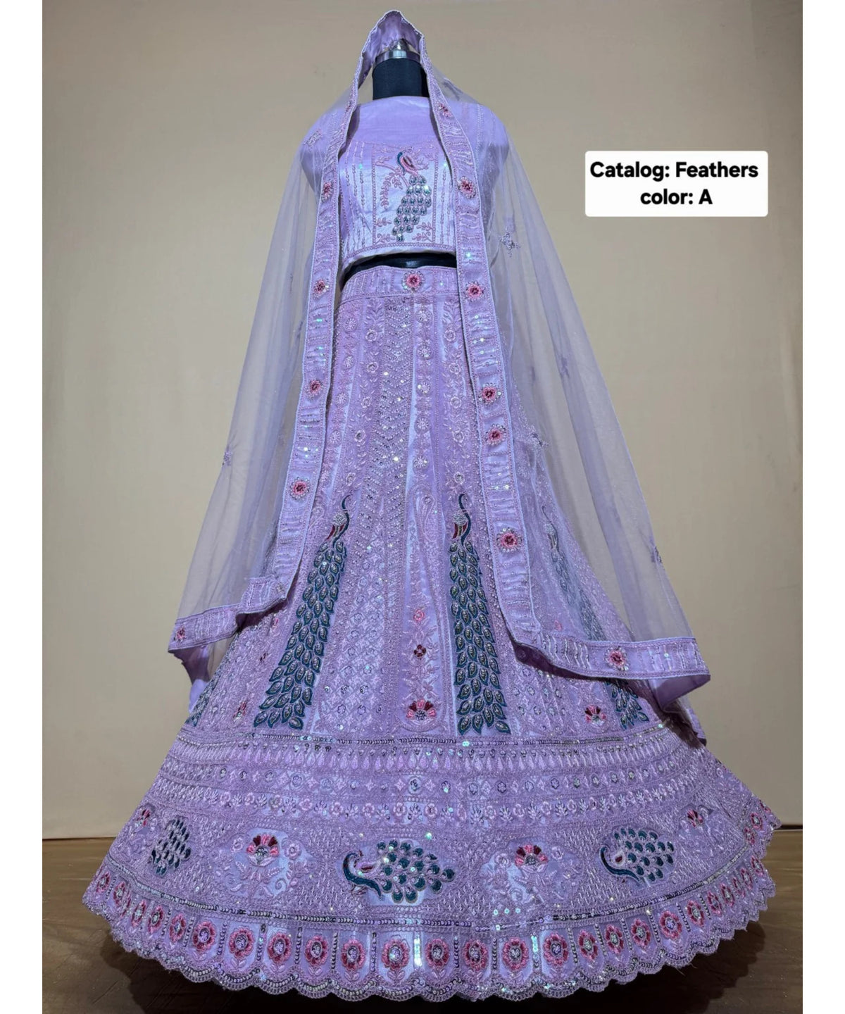 Feathers — A – Lavender; original photograph showing the semi-stitched size 44 lehenga and unstitched blouse fabric with peacock embroidery.