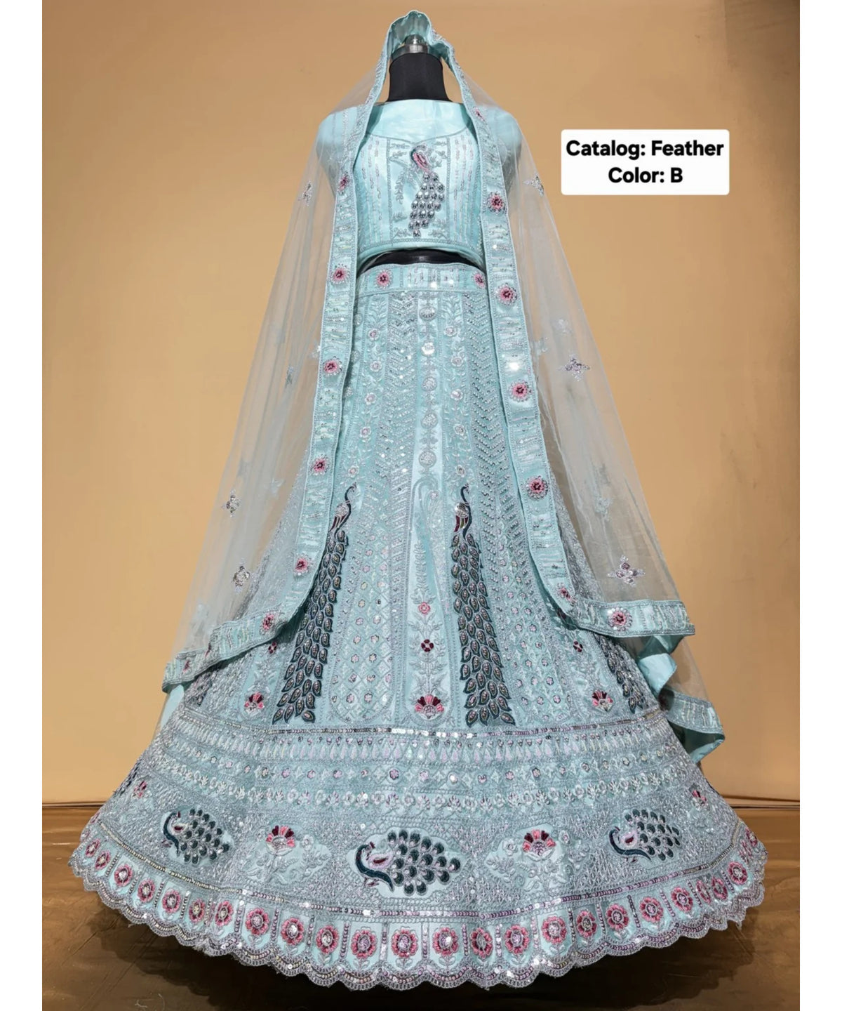 Feathers — B – Ice Blue; original photograph showing the semi-stitched size 44 lehenga and unstitched blouse fabric with peacock embroidery.