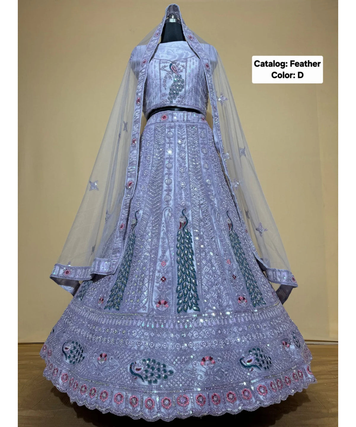 Feathers — D – Periwinkle; original photograph showing the semi-stitched size 44 lehenga and unstitched blouse fabric with peacock embroidery.