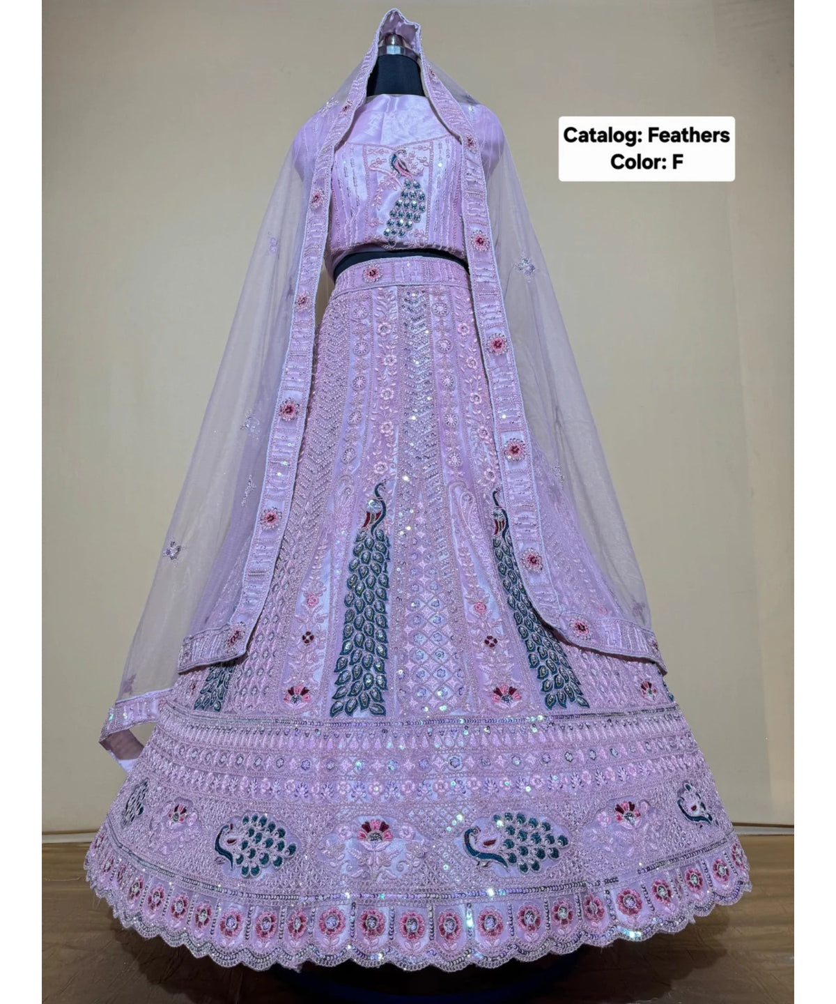 Feathers — F – Lilac; original photograph showing the semi-stitched size 44 lehenga and unstitched blouse fabric with peacock embroidery.