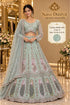 Shubh Labh — Color D, Mint — saved model wearing embellished peacock lehenga with sheer sleeves; sizes 38, 40, 42 and 44.
