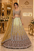 PAD11001 - Exp 11, Color A, size 42 - model wearing the mustard and lemon-to-brown ombre embellished lehenga in the Saree Duniya showroom.