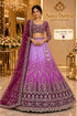 PAD11001 - Exp 11, Color B, size 42 - model wearing the lilac, magenta and plum ombre embellished lehenga in the Saree Duniya showroom.