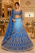 PAD11001 - Exp 11, Color C, size 42 - model wearing the sky blue and royal blue ombre embellished lehenga in the Saree Duniya showroom.