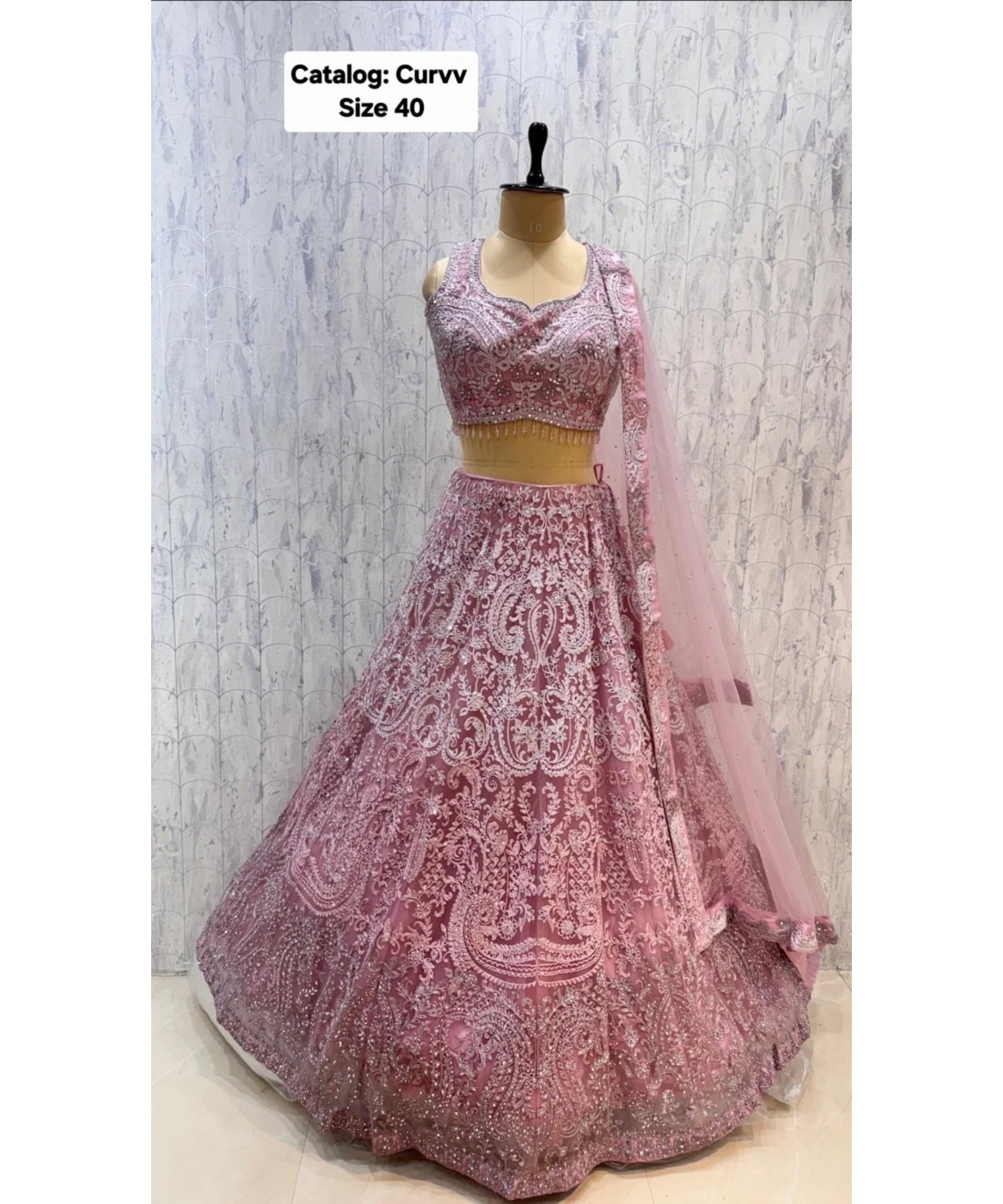 Catalog: Curvv - Exp 11. Pink, size 40. Original front photograph of fully stitched embroidered lehenga.
