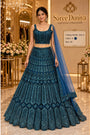 Saree Duniya Catalog: Kanika - Exp 11. Color A, size 40. Model wearing the fully stitched sequin-embellished lehenga with coordinating blouse and sheer dupatta.