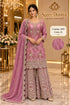 Saree Duniya Catalog 1681 Color B - adult model wearing the dusty rose pink with a muted mauve undertone and metallic shimmer embellished designer suit with matching palazzo pants and dupatta